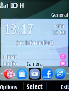 Scroll to the camera icon and press the Navigation key.