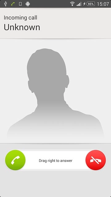 Press the reject call icon and drag the icon left.
