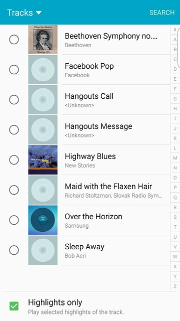 Go to the required folder.Press the different ring tones to listen to them.