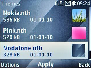 Highlight the required theme and press the Navigation key.