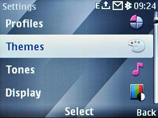Scroll to Themes and press the Navigation key.