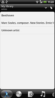 Press the required category at the bottom of the display.Go to the required audio file or playlist.