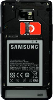 Place your SIM as shown on the SIM holder and slide it in.