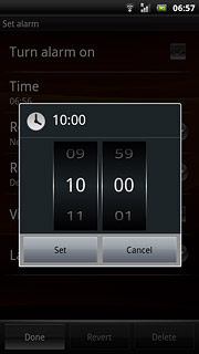 Slide hours and minutes up or down to set the time.