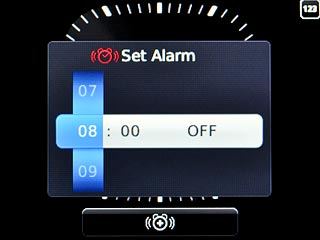 Highlight hours and minutes and and slide your finger up or down the Navigation key to set the alarm time.