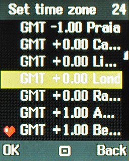 Highlight the required time zone and press the Navigation key.