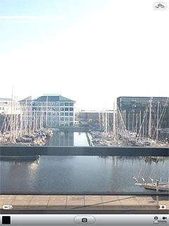 To zoom in or out:Press anywhere on the display.Press + or - to zoom in or out.