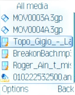 Highlight the required audio file or the required playlist and press the Navigation key.