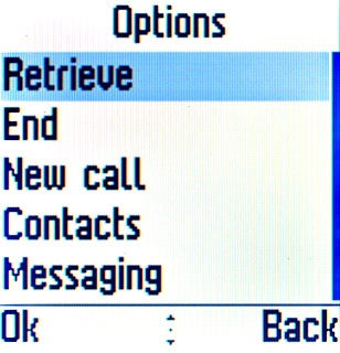 Scroll to Retrieve and press the Navigation key to activate the call on hold.