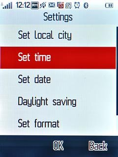 Press Set time.Key in the time.