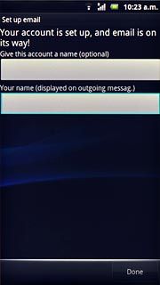 Press the field below Your name (displayed on outgoing messag.) and key in the required sender name.