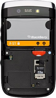 Take hold of the right side of the battery and remove it.