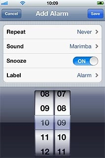Drag the wheels to set the time for the alarm.