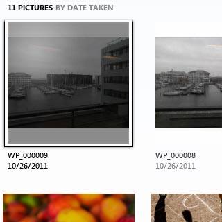 Highlight the required picture or the required video clip and drag it to the computer icon in the bottom left corner of the screen.