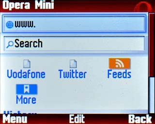 Highlight the address bar at the top of the display and press the Navigation key.