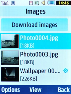 Go to the required folder.Highlight the required picture or the required video clip and press the Navigation key.