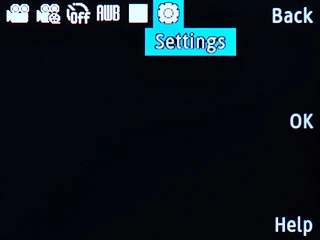 Scroll to Settings and press the Navigation key.