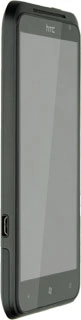 Connect the charger or data cable to the phone socket and to a wall socket or your computer's USB port.