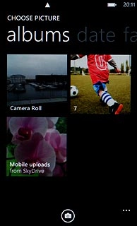 To take a new picture:Press the camera icon.