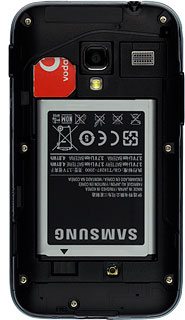 Take hold of the top of the battery and remove it.