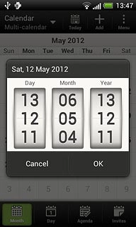 Press and drag day, month and year up or down to select the required date.