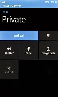 Press PRESS TO SWAP to swap calls.