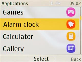 Scroll to Alarm clock and press the Navigation key.