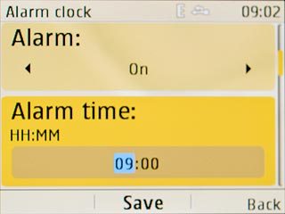 Scroll to Alarm time and key in the required alarm time.