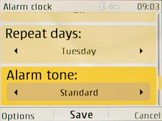 Scroll to Alarm tone and press Navigation key right to select Standard, Radio or Open Gallery.