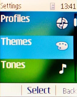 Scroll to Themes and press the Navigation key.