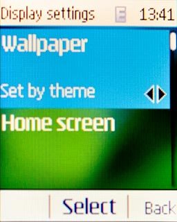 Scroll to Wallpaper and press the Navigation key.