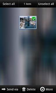 When a picture or video clip is ticked (V), it's selected.