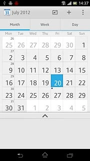 Go to month view (see above).Slide you finger right or left on the display to select the required month.