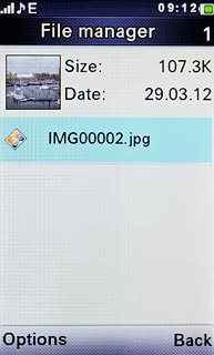 Go to the required folder.Highlight the required picture or the required video clip and press the Navigation key.