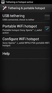 When the box next to the menu item is ticked (V), the Wi-Fi hotspot is turned on.
