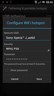 Press the field below Network SSID and key in the required name for the Wi-Fi hotspot.