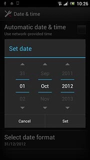 Slide day, month and year up or down to set the date.