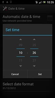 Slide hours and minutes up or down to set the time.