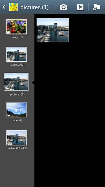 Go to the required folder.Press and hold the required picture or the required video clip to highlight it.