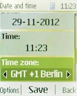 Scroll to Time zone and press Navigation key right to select the required time zone.