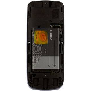 Take hold of the top of the battery and remove it.