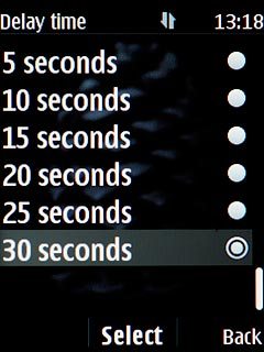Highlight the required divert delay time and press the Navigation key.